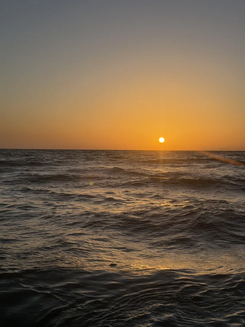 Sunset over open water