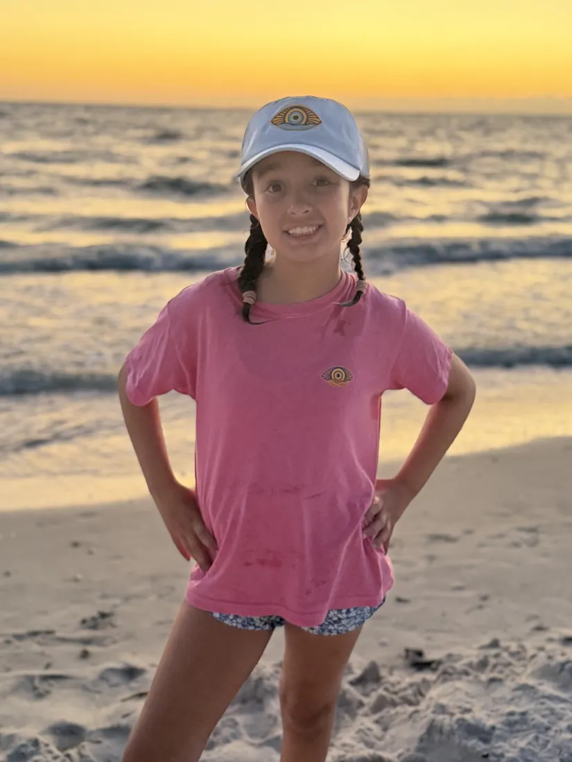 A youth tee at the shoreline